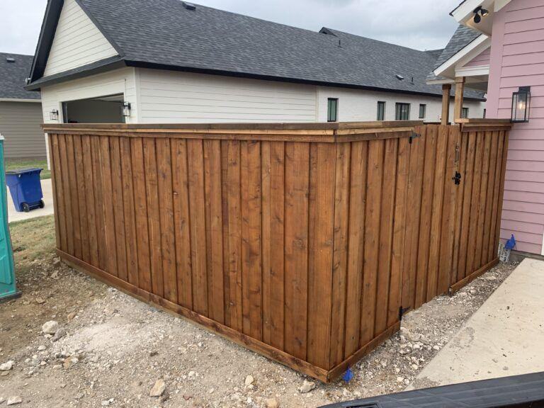 Six foot cedar board-on-board fence
