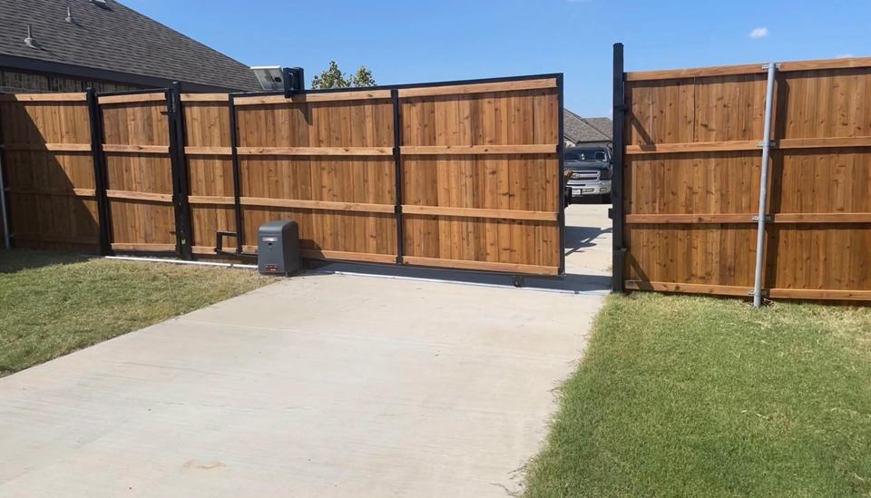 Cedar slide gate with steel frame and gate opener