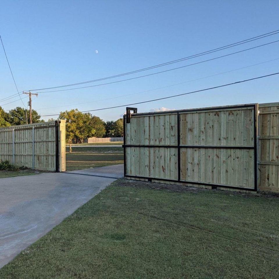 Board-on-board cedar slide gate on a steel frame