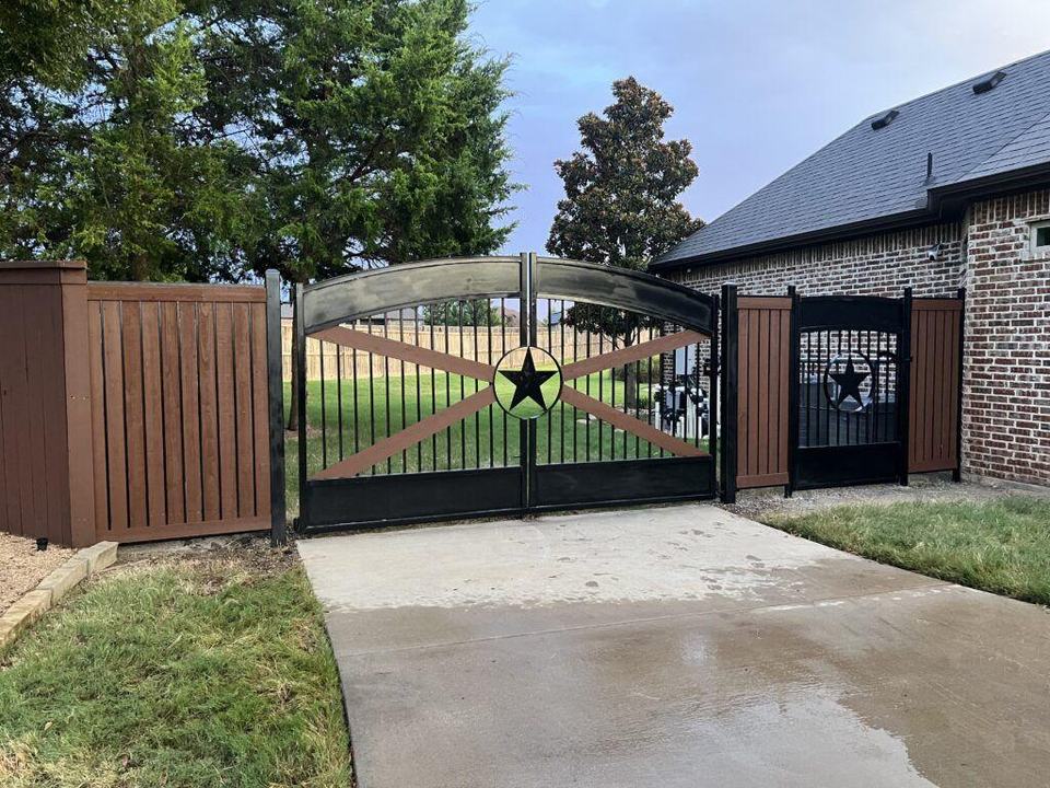 Custom dual swing driveway gate with matching iron fence