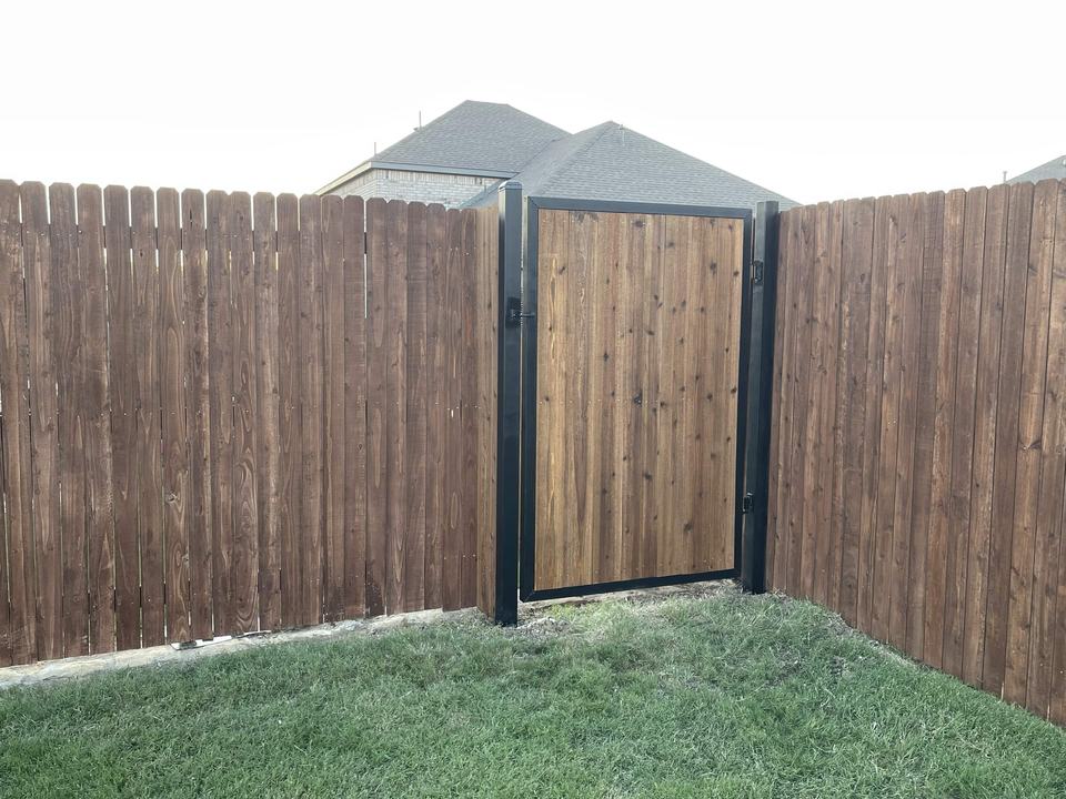Stained cedar fence with steel-framed walk gate