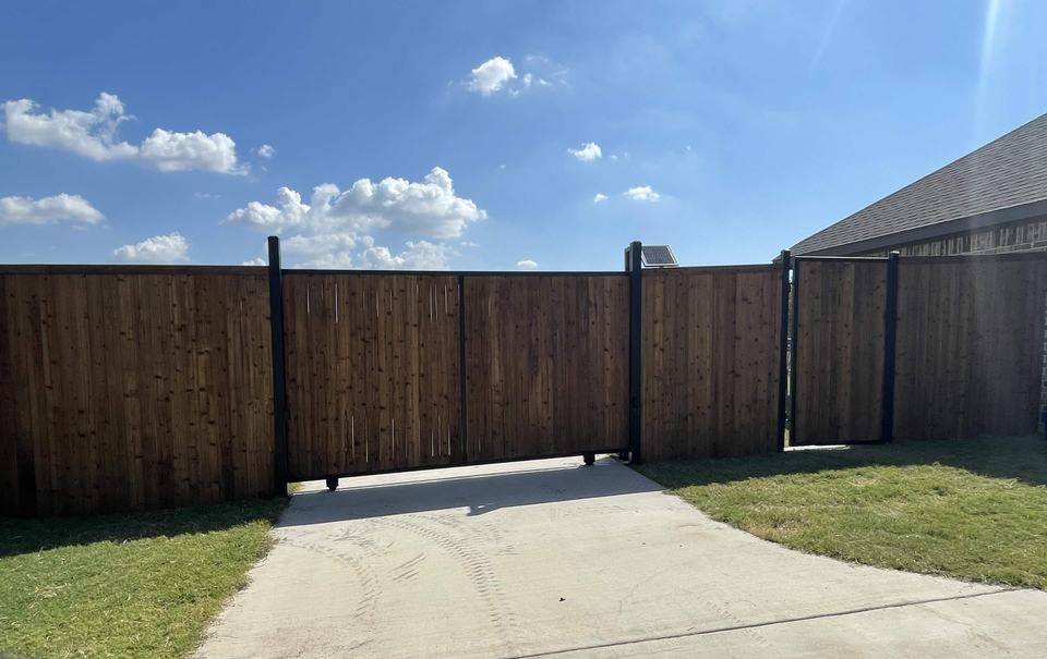 Stained cedar slide gate on a steel frame