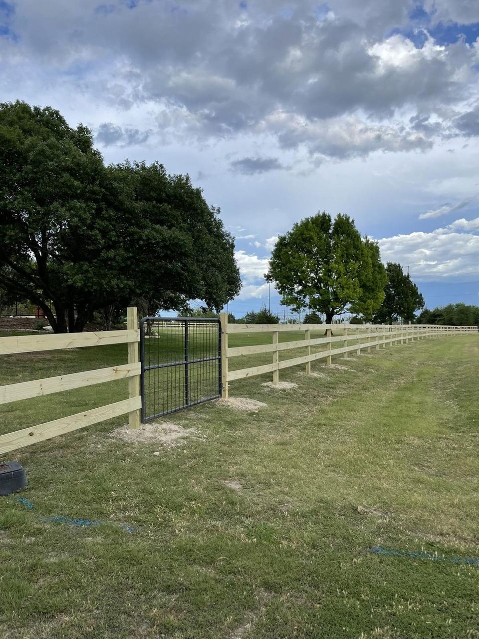 Three-rail wood ranch fence